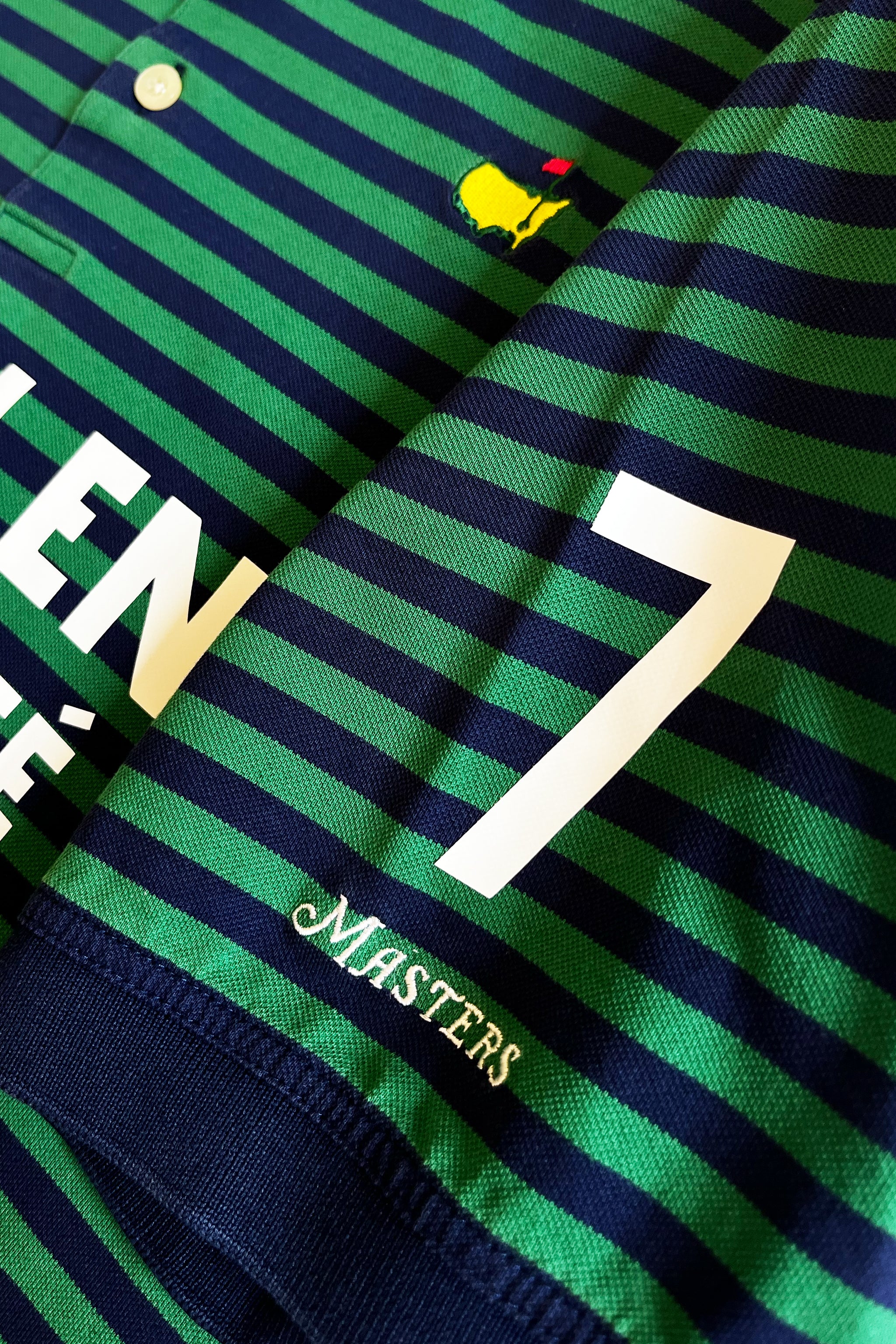 KOEPKA No. 7 Golf Jersey – Mintlen Golf Café – Azalea Green and Navy Blue Stripes | 1 of 18